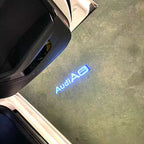 AUDI LOGO PROJECTOT LIGHTS Nr.46 (الكمية 1 = 2 Logo Films /2 أضواء الباب)