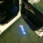 AUDI LOGO PROJECTOT LIGHTS Nr.53 (الكمية 1 = 2 Logo Films /2 أضواء الباب)