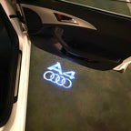 AUDI LOGO PROJECTOT LIGHTS Nr.120 (الكمية 1 = 2 Logo Films /2 أضواء الباب)