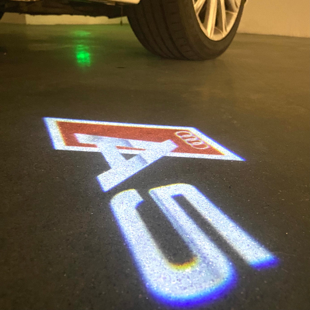 AUDI LOGO PROJECTOT LIGHTS Nr.120 (الكمية 1 = 2 Logo Films /2 أضواء الباب)