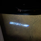 AUDI LOGO PROJECTOT LIGHTS Nr.19 (الكمية 1 = 2 Logo Films /2 أضواء الباب)