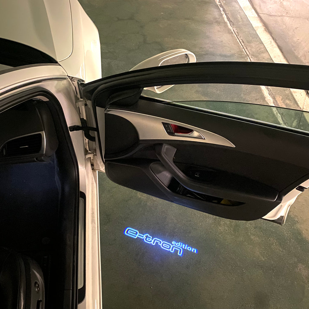 AUDI LOGO PROJECTOT LIGHTS Nr.19 (الكمية 1 = 2 Logo Films /2 أضواء الباب)