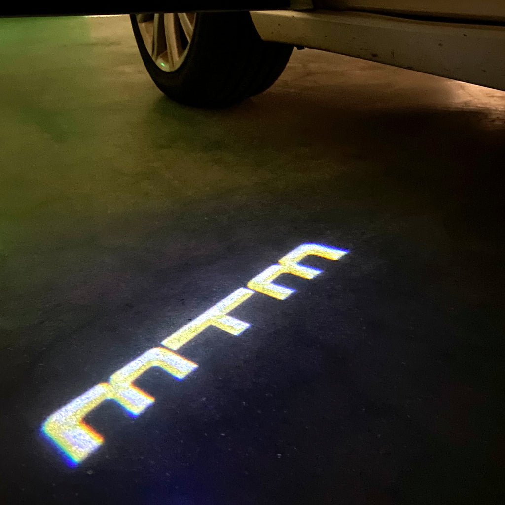 AUDI LOGO PROJECTOT LIGHTS Nr.86 (الكمية 1 = 2 Logo Films /2 أضواء الباب)
