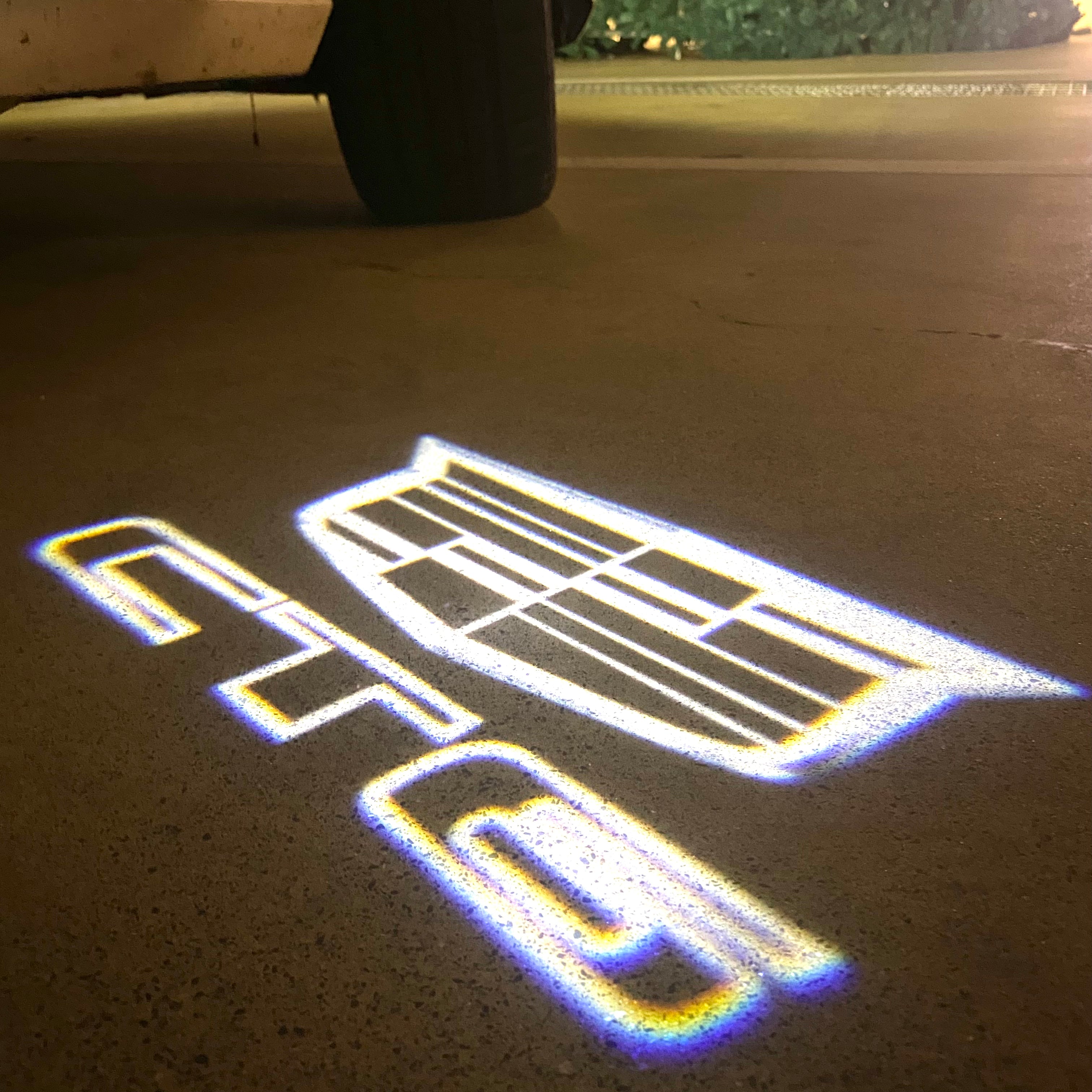 AUDI LOGO PROJECTOT LIGHTS Nr.19 (الكمية 1 = 2 Logo Films /2 أضواء الباب)