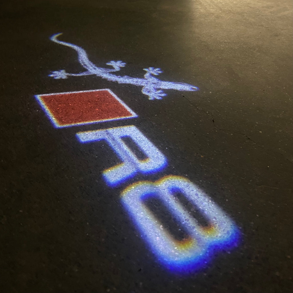 AUDI LOGO PROJECTOT LIGHTS Nr.120 (الكمية 1 = 2 Logo Films /2 أضواء الباب)