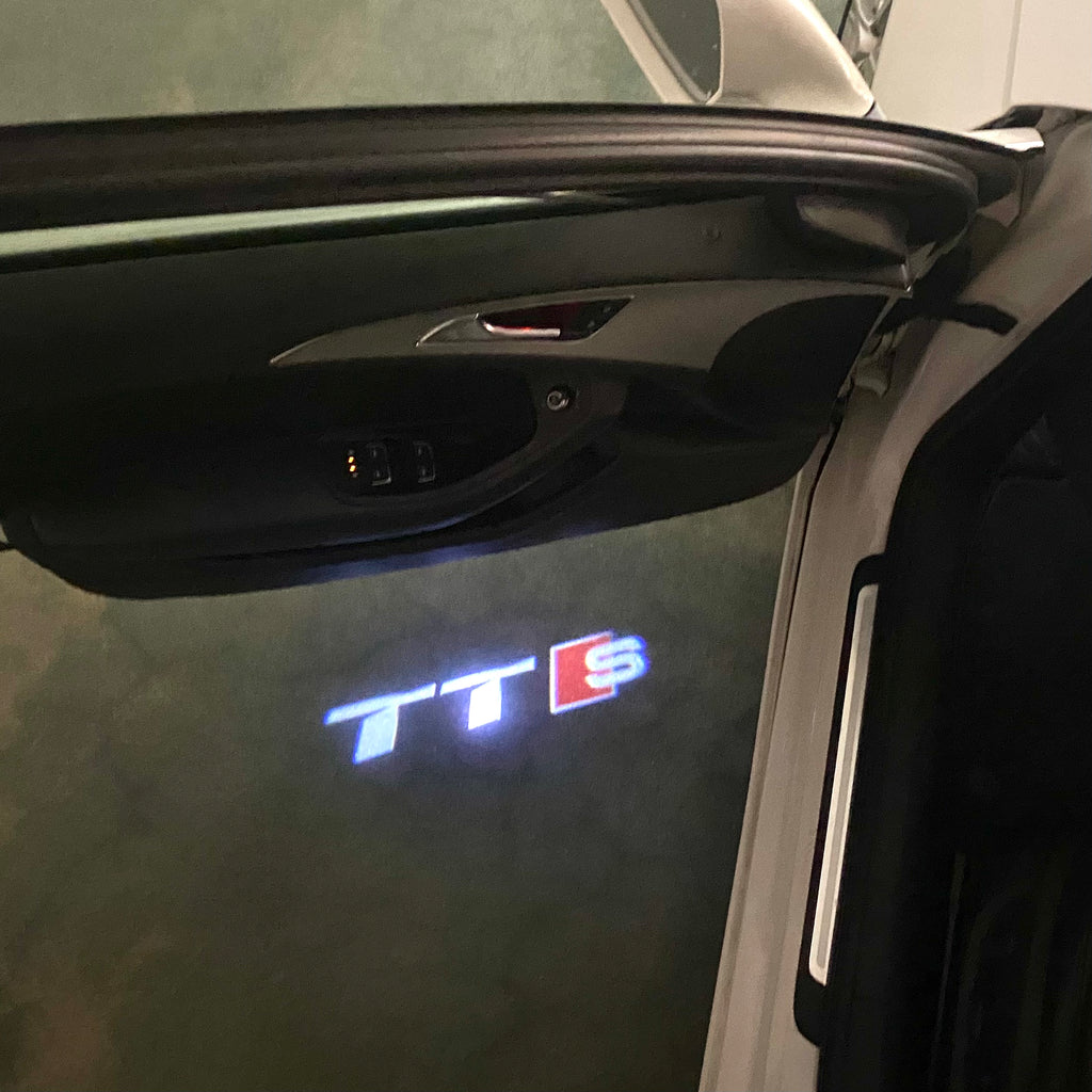 AUDI LOGO PROJECTOT LIGHTS Nr.120 (الكمية 1 = 2 Logo Films /2 أضواء الباب)