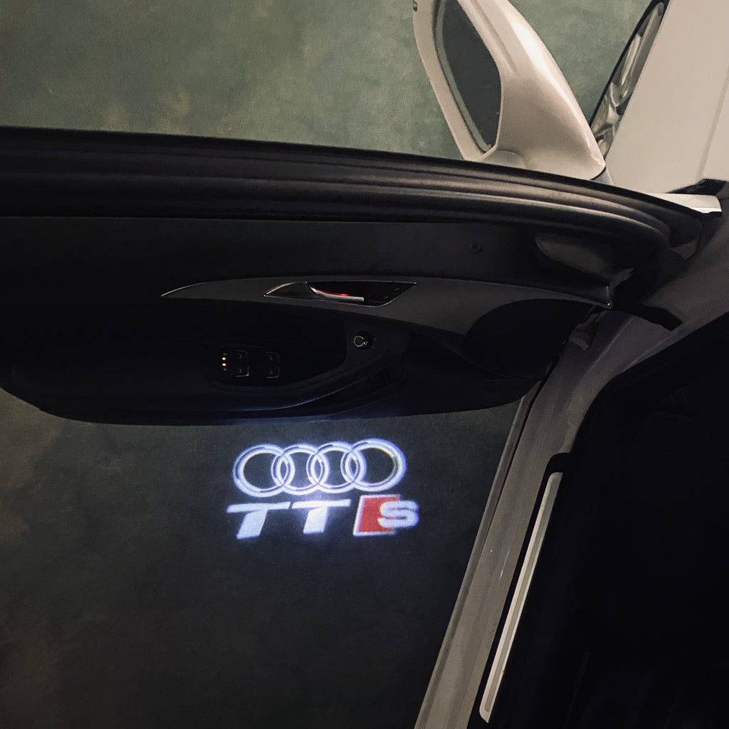 AUDI LOGO PROJECTOT LIGHTS Nr.120 (الكمية 1 = 2 Logo Films /2 أضواء الباب)