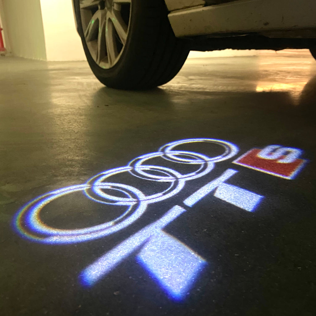 AUDI LOGO PROJECTOT LIGHTS Nr.120 (الكمية 1 = 2 Logo Films /2 أضواء الباب)