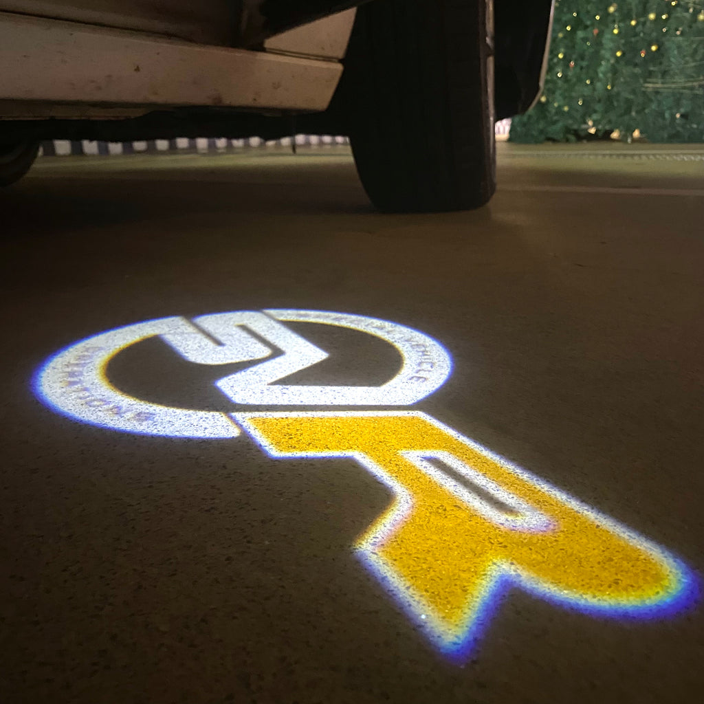 Land Rover LOGO PROJECROTR LIGHTS Nr.04 (الكمية 1 = 1 مجموعة / 2 أضواء باب)