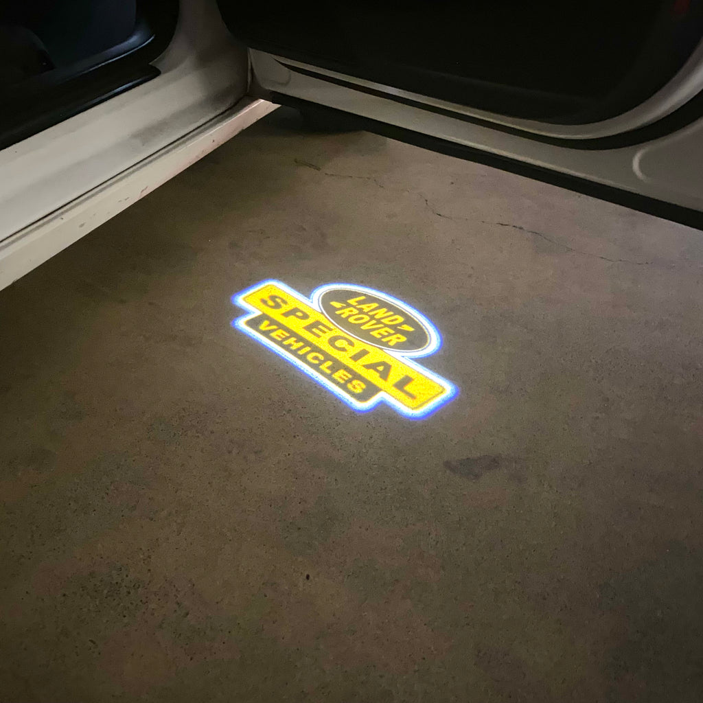 Land Rover LOGO PROJECROTR LIGHTS Nr.04 (الكمية 1 = 1 مجموعة / 2 أضواء باب)