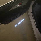 AUDI LOGO PROJECTOT LIGHTS Nr.19 (الكمية 1 = 2 Logo Films /2 أضواء الباب)