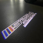 BMW M3 LOGO PROJECTOR LIGHTS Nr.24 (الكمية 1 = 1 مجموعة / 2 أضواء باب)