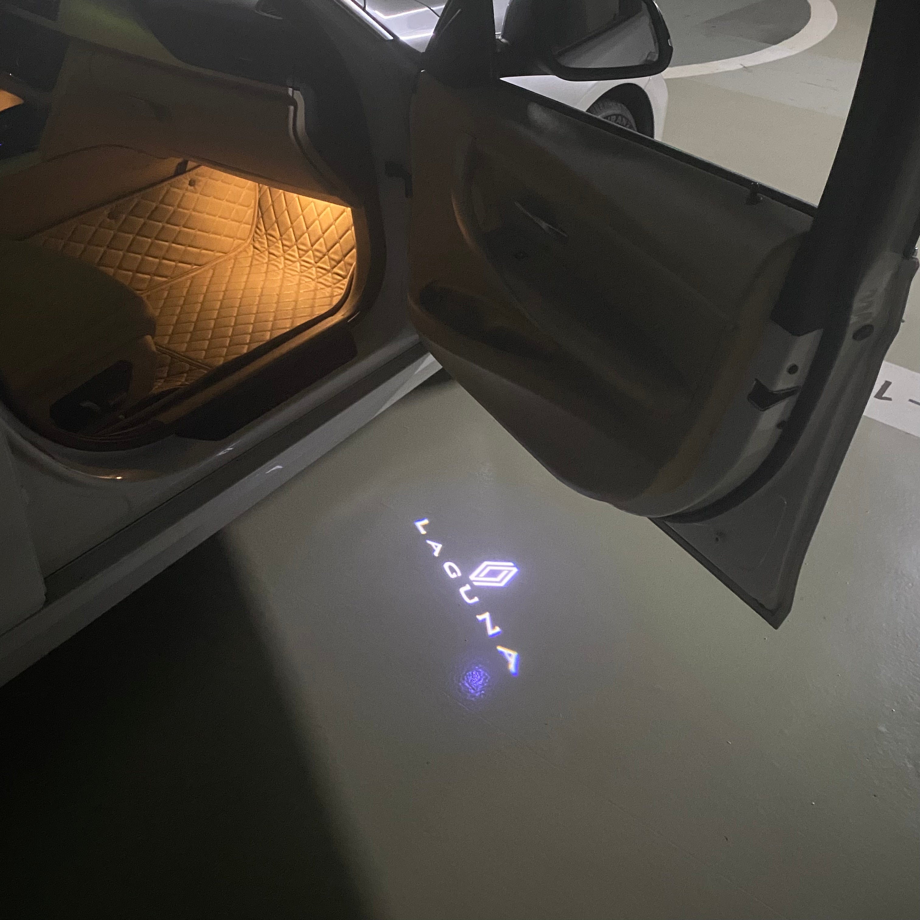 RENAULT Laguna LOGO PROJECROTR LIGHTS Nr.0919 (quantity  1 =  2 Logo Film & 2 door lights)