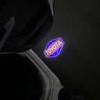 TOYOTA  ORIGINAL LOGO PROJECROTR LIGHTS  (quantity 1 = 1 sets/2 door lights) Nr.0G45