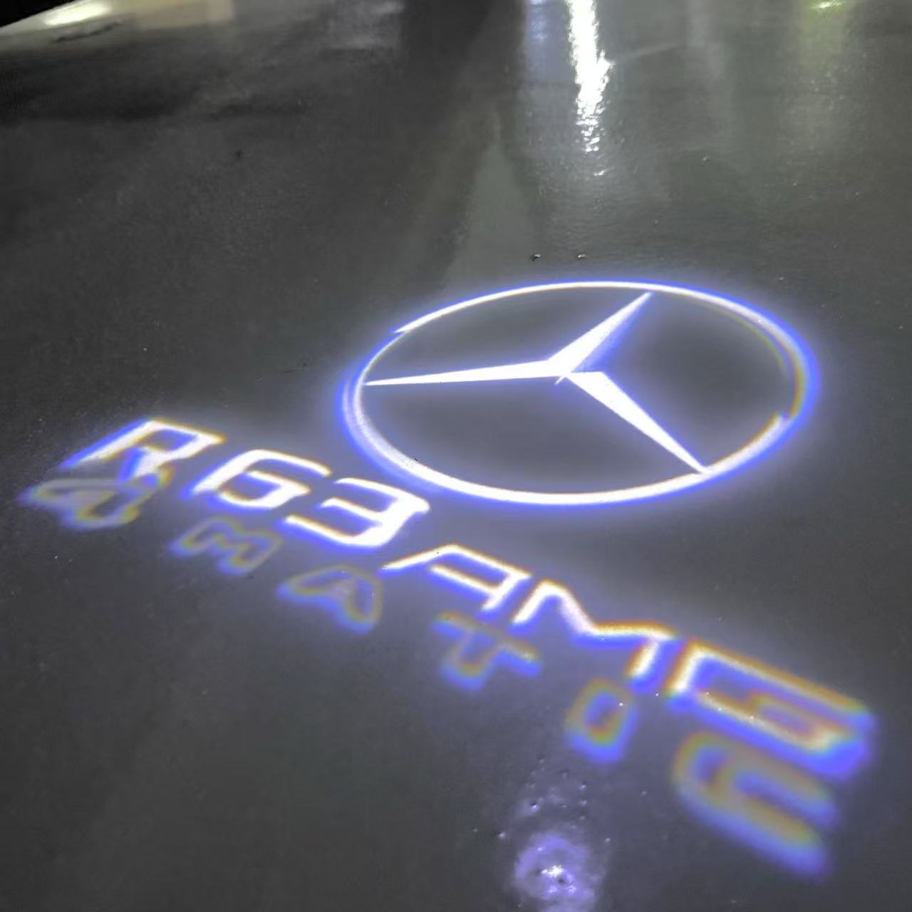 MERCEDES BENZ R 63 AMG LOGO PROJECTOR LIGHTS  (quantity 1 = 1 sets/2 door lights)Nr.03f026