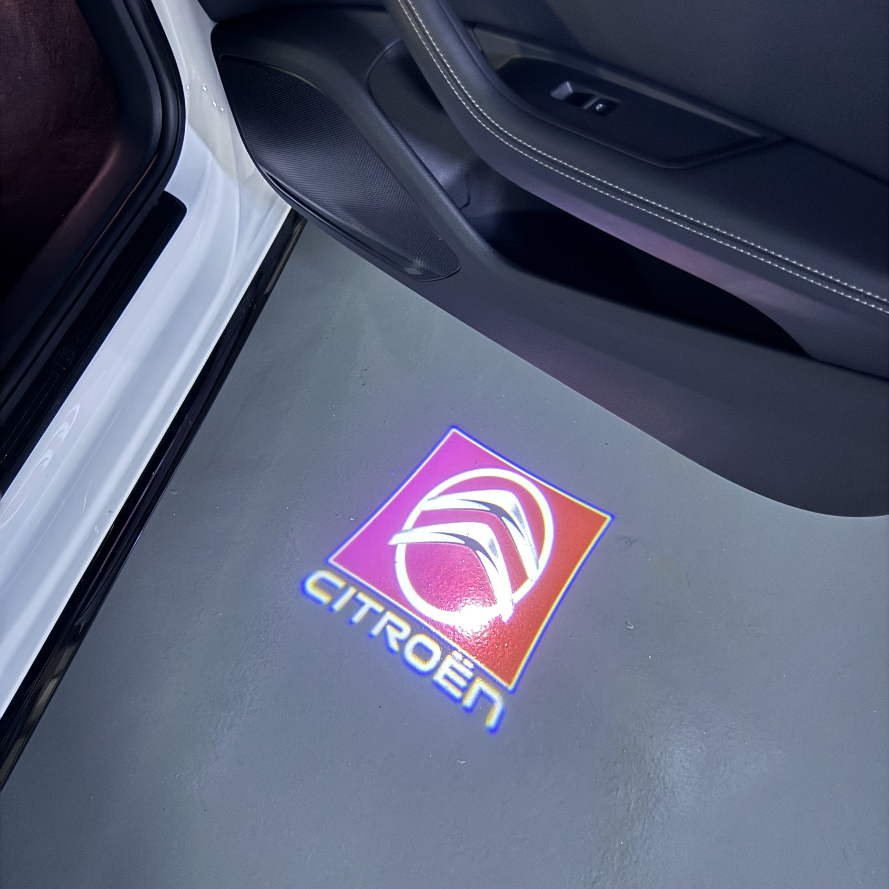 CITROËN Original   LOGO PROJECTOT LIGHTS (quantity 1 = 1 sets/2 door lights) Nr.6024q0t0144