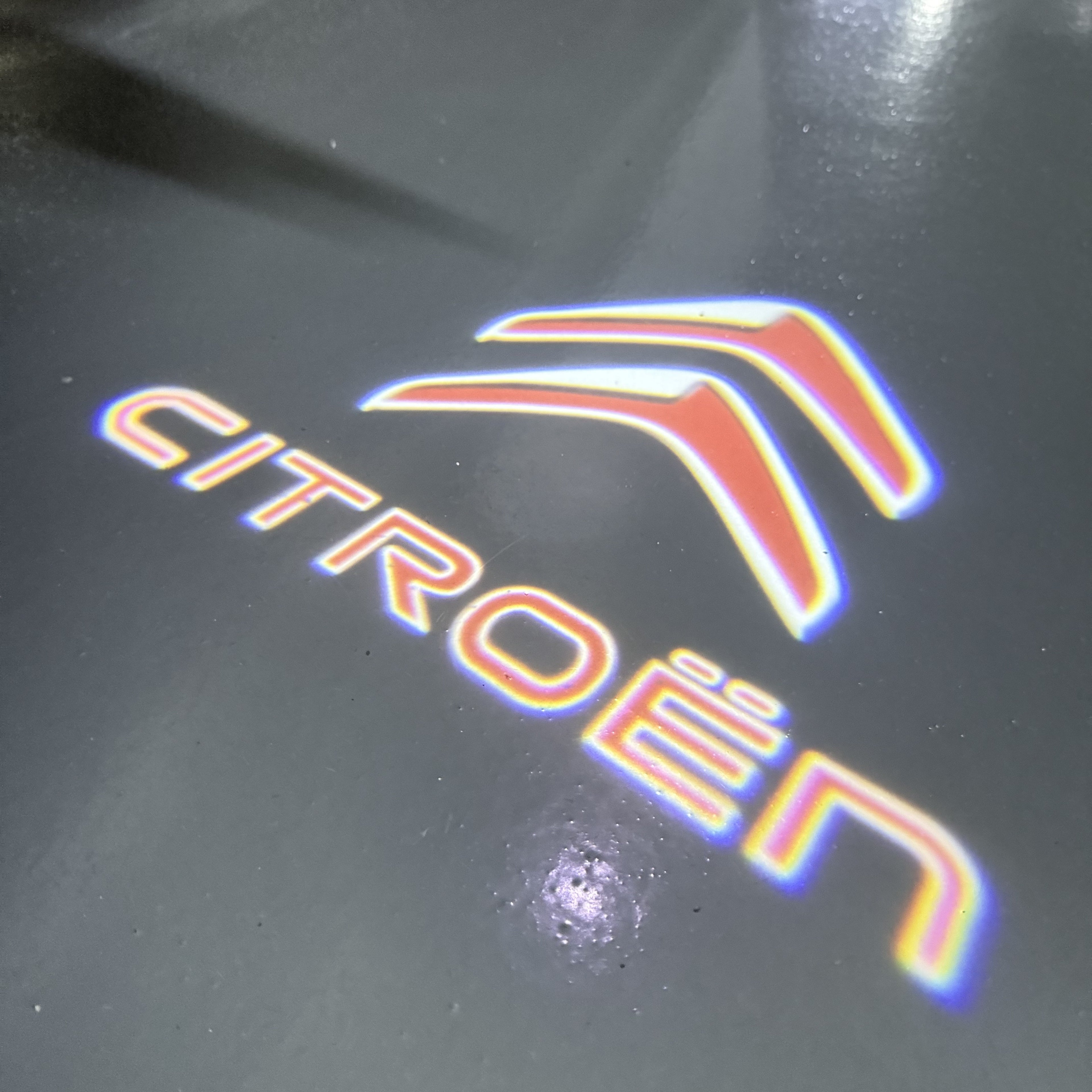CITROËN Original   LOGO PROJECTOT LIGHTS (quantity 1 = 1 sets/2 door lights) Nr.6024q0t0123