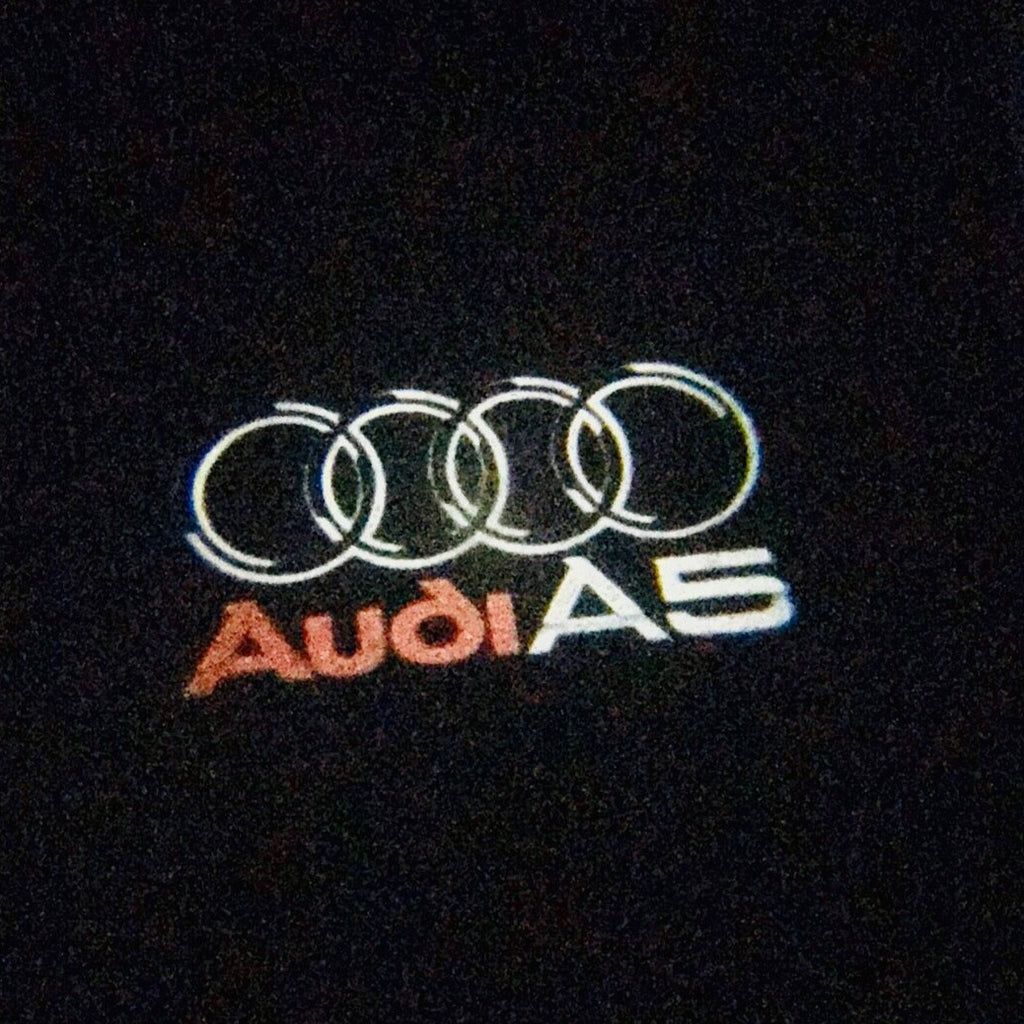AUDI LOGO PROJECTOT LIGHTS Nr.43 (الكمية 1 = 2 Logo Films /2 أضواء الباب)