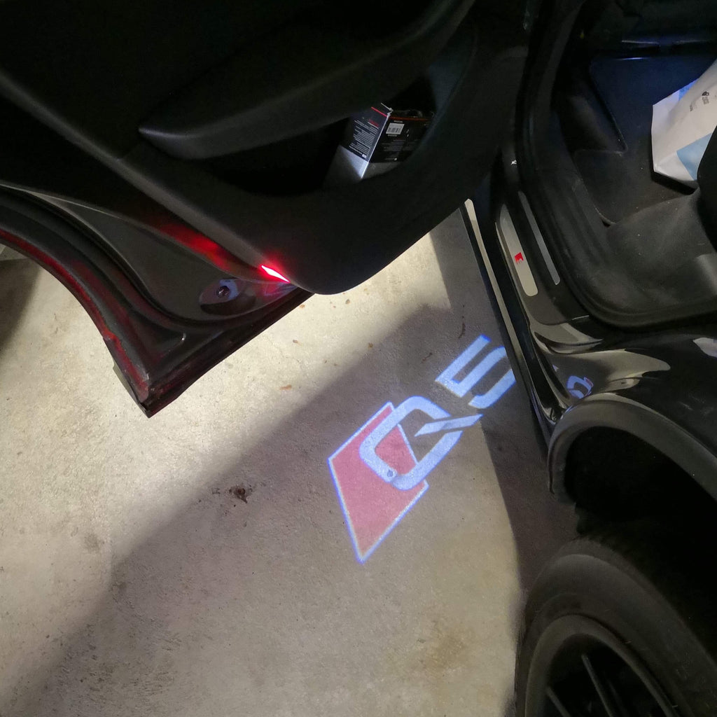 AUDI LOGO PROJECTOT LIGHTS Nr.78 (الكمية 1 = 2 Logo Films /2 أضواء الباب)