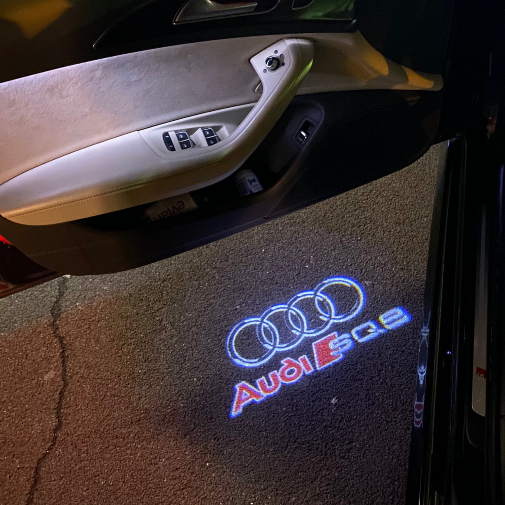 AUDI LOGO PROJECTOT LIGHTS Nr.255 (الكمية 1 = 2 Logo Films /2 أضواء الباب)