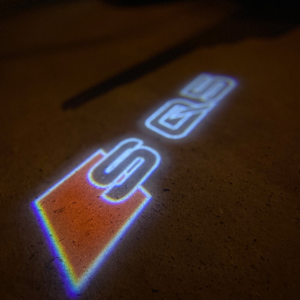 AUDI LOGO PROJECTOT LIGHTS Nr.19 (الكمية 1 = 2 Logo Films /2 أضواء الباب)
