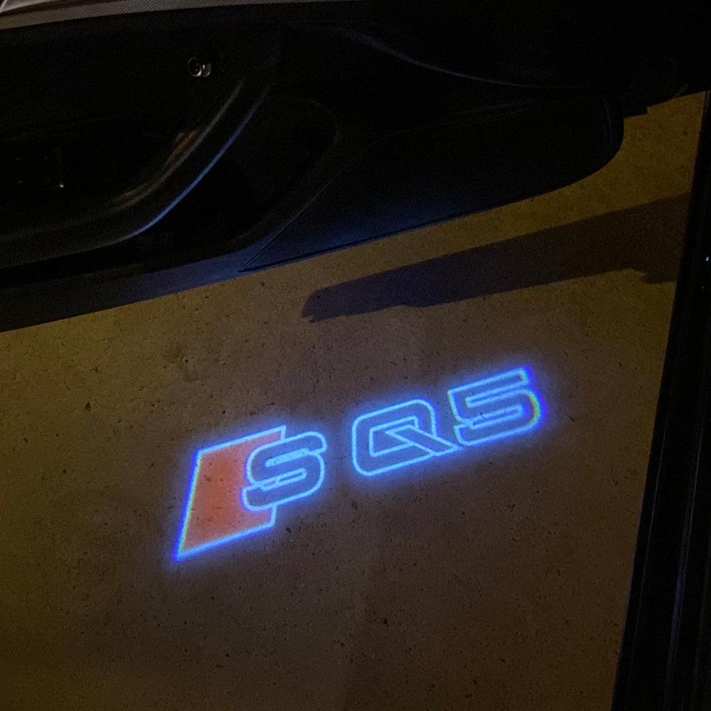 AUDI LOGO PROJECTOT LIGHTS Nr.19 (الكمية 1 = 2 Logo Films /2 أضواء الباب)