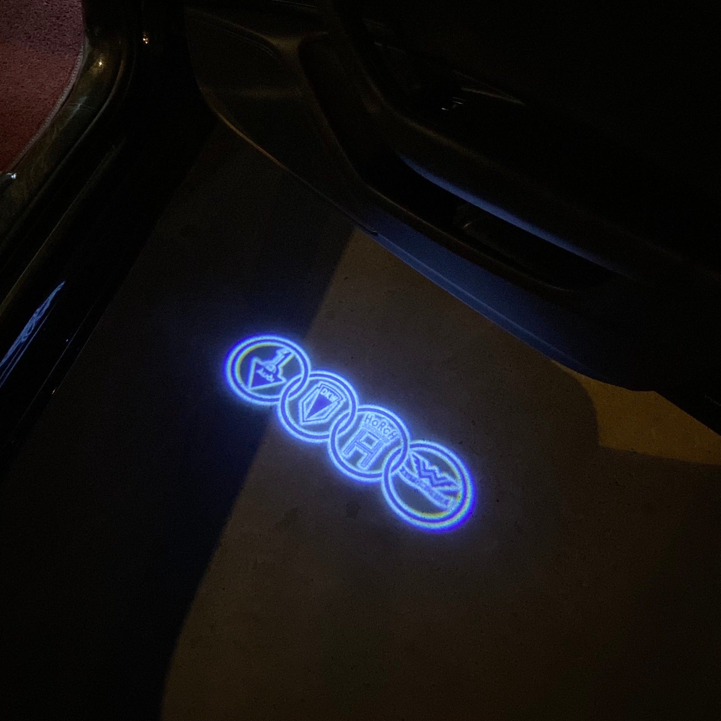 AUDI LOGO PROJECTOT LIGHTS Nr.19 (الكمية 1 = 2 Logo Films /2 أضواء الباب)