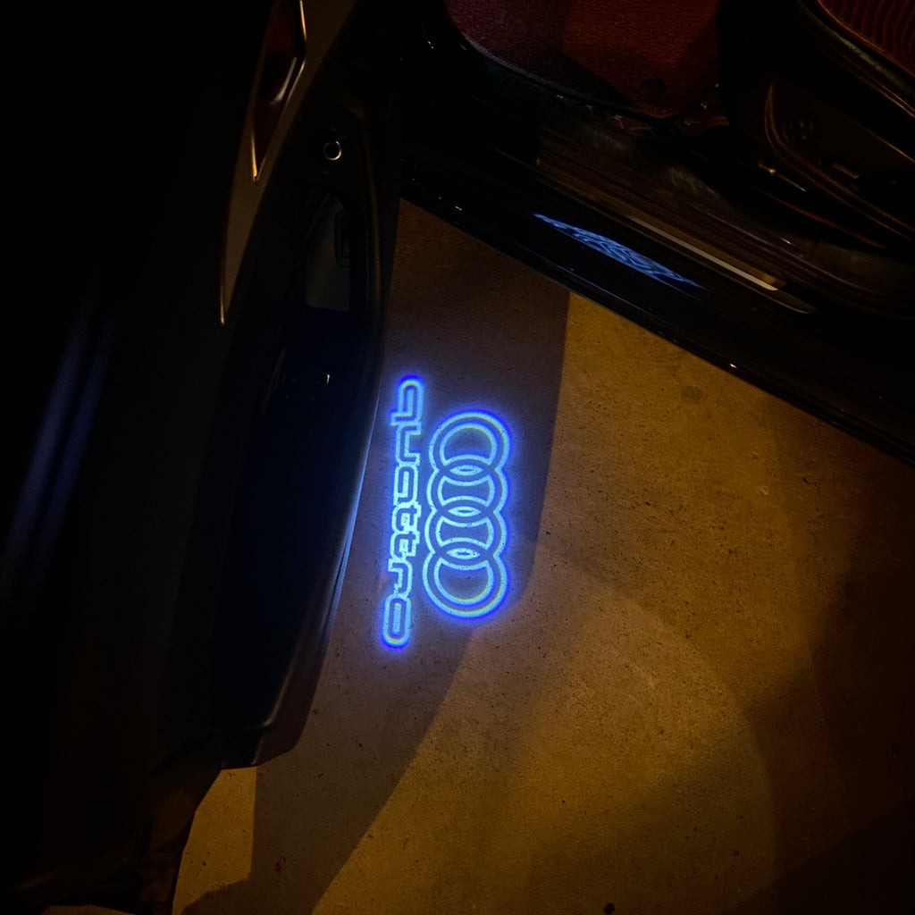 AUDI LOGO PROJECTOT LIGHTS Nr.19 (الكمية 1 = 2 Logo Films /2 أضواء الباب)