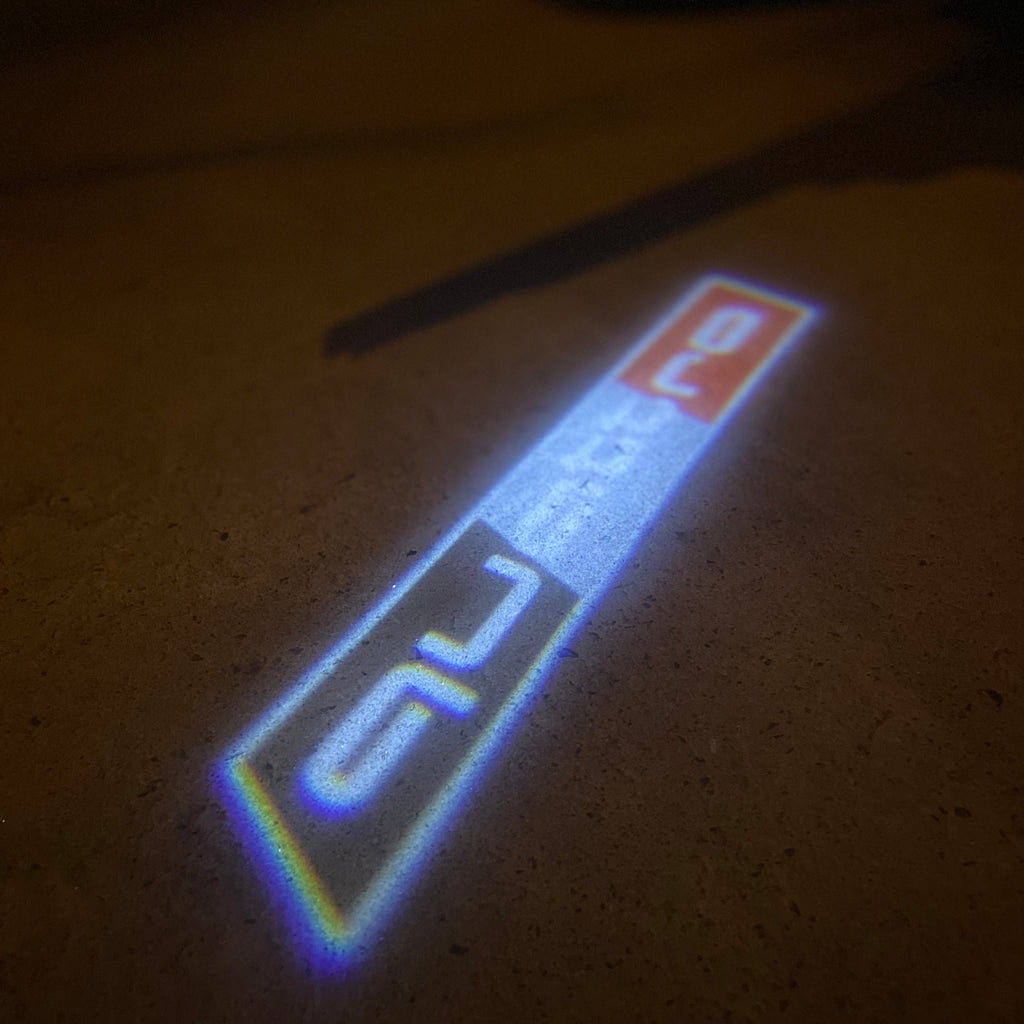 AUDI LOGO PROJECTOT LIGHTS Nr.19 (الكمية 1 = 2 Logo Films /2 أضواء الباب)