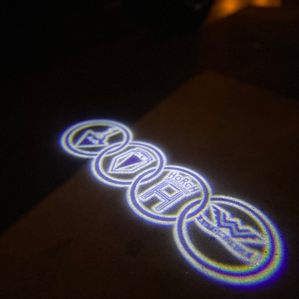 AUDI LOGO PROJECTOT LIGHTS Nr.19 (الكمية 1 = 2 Logo Films /2 أضواء الباب)