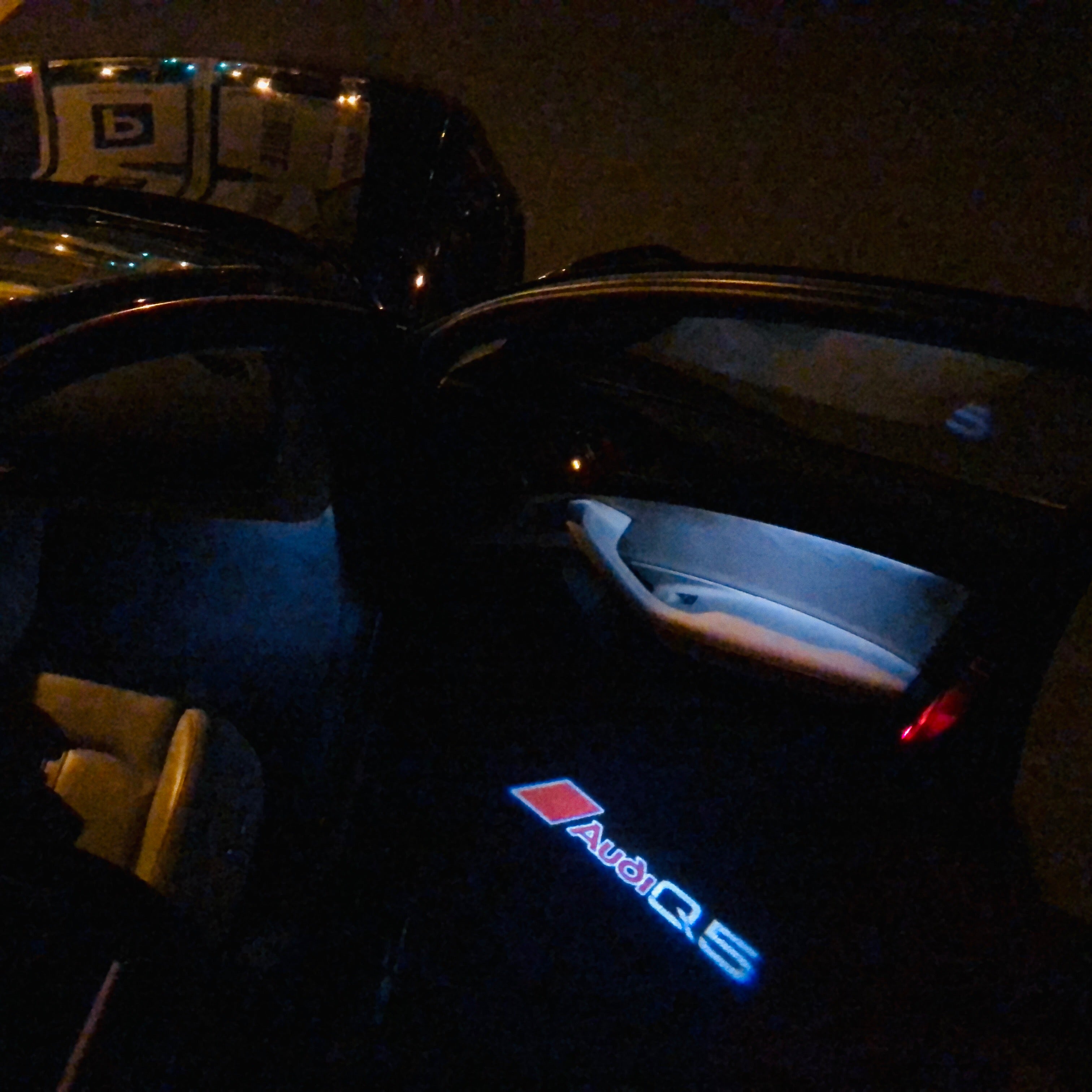 AUDI LOGO PROJECTOT LIGHTS Nr.81 (الكمية 1 = 2 Logo Films /2 أضواء الباب)