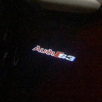أضواء جهاز عرض شعار AUDI رقم 87 (الكمية 1 = 2 فيلم شعار / 2 مصباح باب)