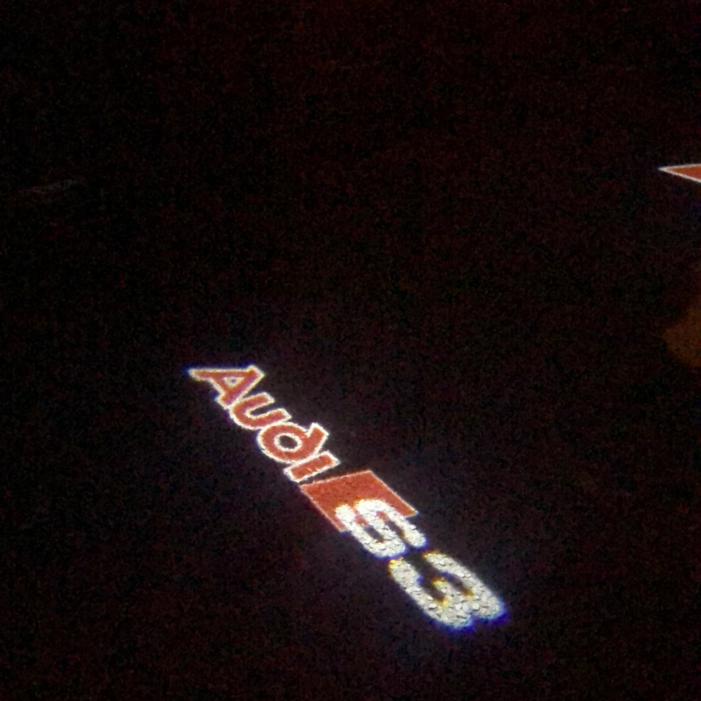 أضواء جهاز عرض شعار AUDI رقم 87 (الكمية 1 = 2 فيلم شعار / 2 مصباح باب)