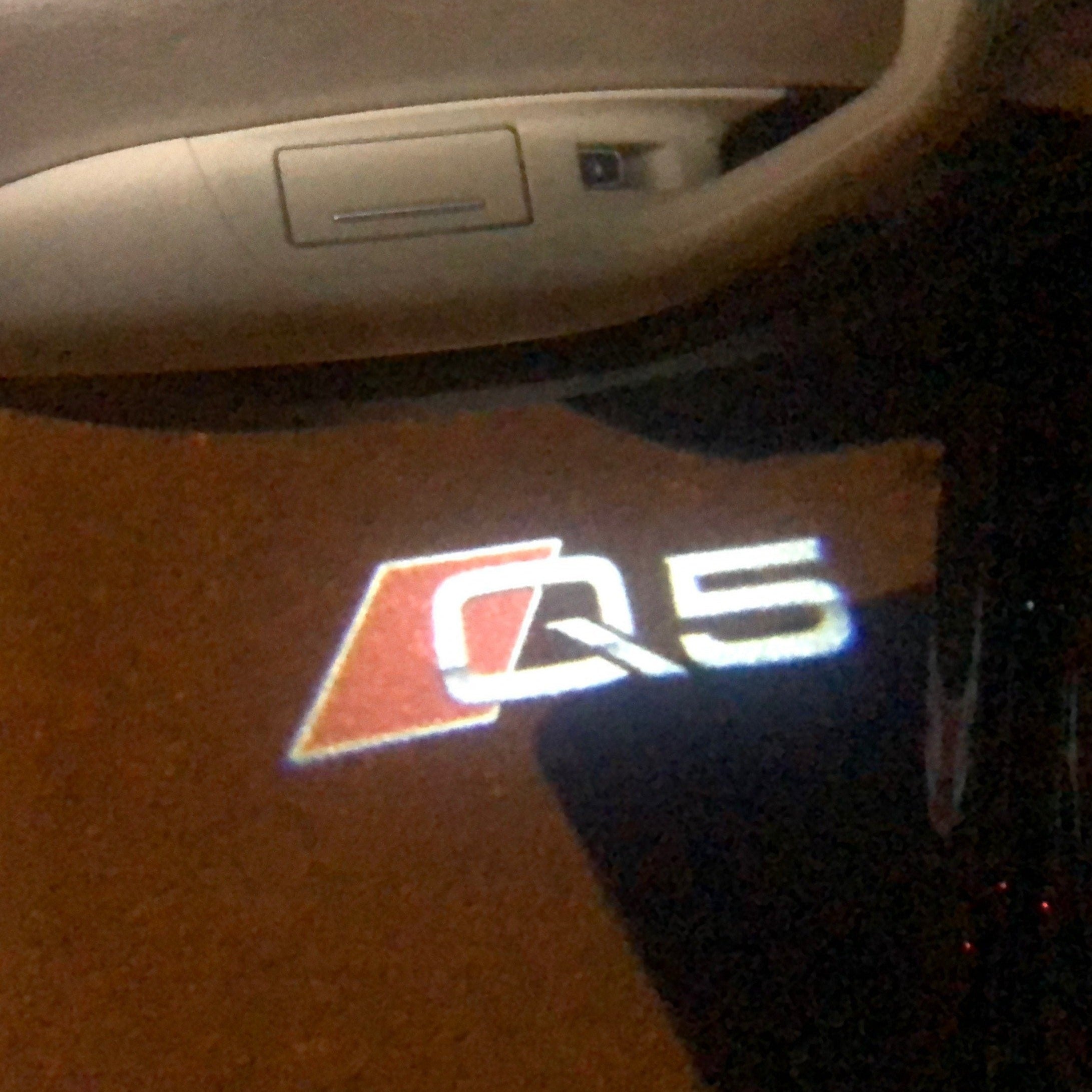 AUDI LOGO PROJECTOT LIGHTS Nr.78 (الكمية 1 = 2 Logo Films /2 أضواء الباب)