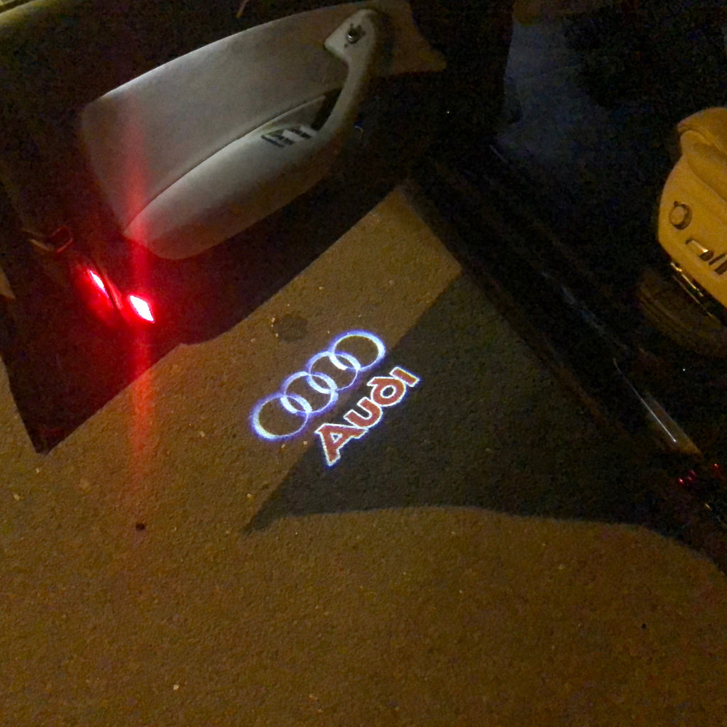 AUDI LOGO PROJECTOT LIGHTS NR. 18 (الكمية 1 = 2 Logo Films /2 door lights）