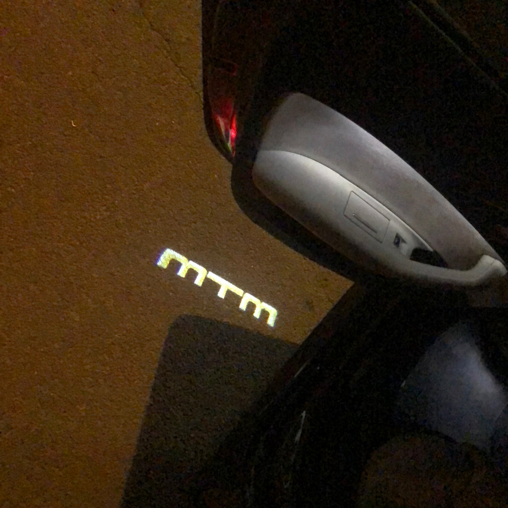 AUDI LOGO PROJECTOT LIGHTS Nr.84 (الكمية 1 = 2 Logo Films /2 أضواء الباب)