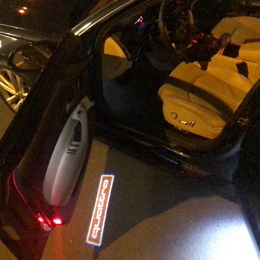 AUDI LOGO PROJECTOT LIGHTS Nr.83 (الكمية 1 = 2 Logo Films /2 أضواء الباب)