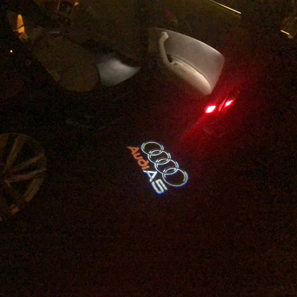 AUDI LOGO PROJECTOT LIGHTS Nr.43 (الكمية 1 = 2 Logo Films /2 أضواء الباب)
