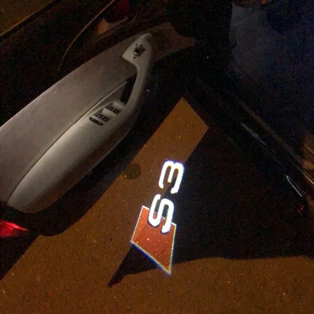 AUDI LOGO PROJECTOT LIGHTS Nr.24 (الكمية 1 = 2 Logo Films /2 أضواء الباب)