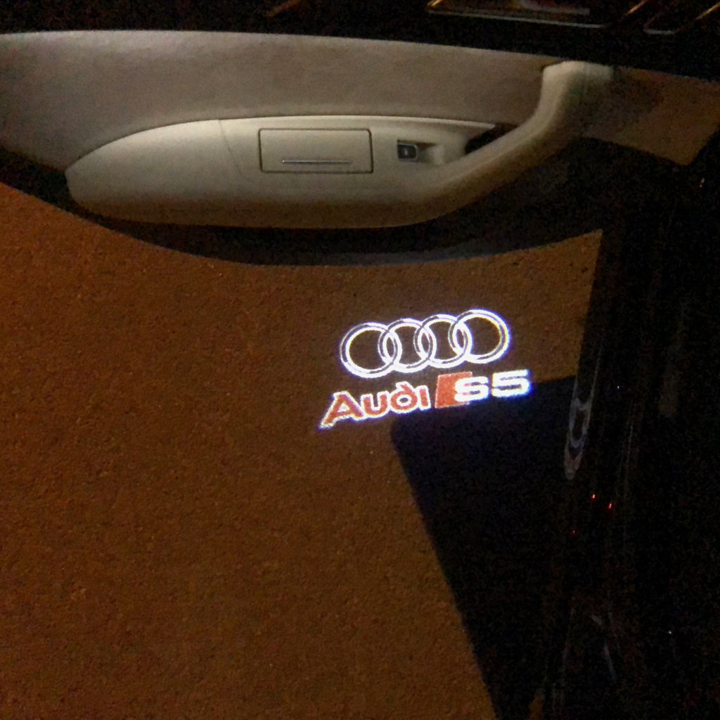 AUDI LOGO PROJECTOT LIGHTS Nr.35 (الكمية 1 = 2 Logo Films /2 أضواء الباب)