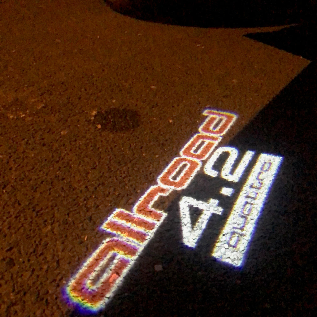 AUDI LOGO PROJECTOT LIGHTS Nr.253 (الكمية 1 = 2 Logo Films /2 أضواء الباب)